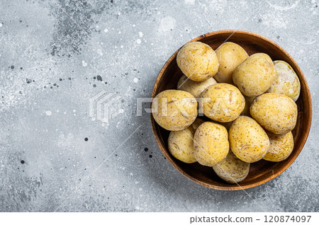 Canarian boiled potatoes papas arrugadas. Gray background. Top view. Copy space Canarian boiled potatoes papas arrugadas. Gray background. Top view. Copy space 120874097