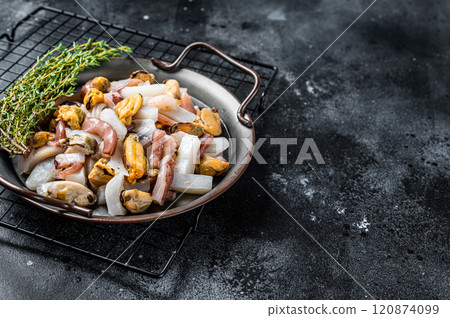 Raw Seafood mix, sea cocktail of fresh mussels, clams, squid, octopus, shrimps and prawn. Black background. Top view. Copy space 120874099