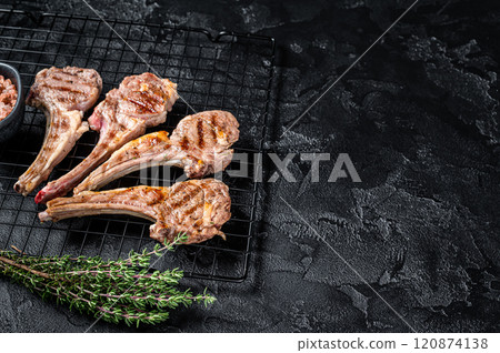 Barbecue Grilled lamb meat chops, mutton cutlets. Black background. Top view. Copy space 120874138