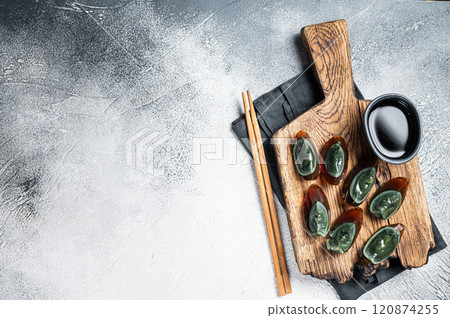 Preserved duck eggs or Century egg, Chinese cuisine. White background. Top view. Copy space Preserved duck eggs or Century egg, Chinese cuisine. White background. Top view. Copy space 120874255