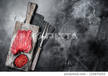 Raw Venison dear steak ready for cooking. Black background. Top view. Copy space 120874263