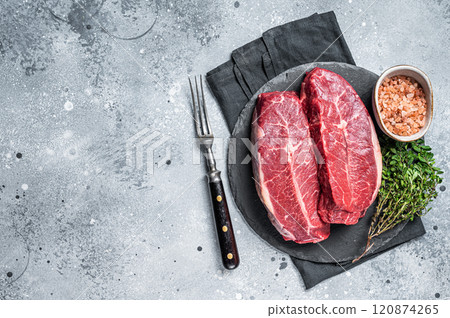 Raw top blade flat Iron beef organic meat. Gray background. Top View. Copy space 120874265