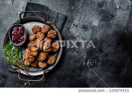 Homemade Swedish meatballs with lingonberries jam. Black background. Top view. Copy space 120874353