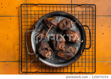 Dried persimmon. japanese Preserve fruit. Orange background. Top view 120874354