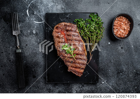BBQ roasted Shoulder Top Blade or Australia wagyu oyster blade beef steak. Black background. Top View BBQ roasted Shoulder Top Blade or Australia wagyu oyster blade beef steak. Black background. Top View 120874393