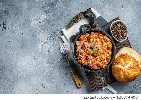 Turkish breakfast with Menemen omelet and bread. Dark background. Top view. Copy space Turkish breakfast with Menemen omelet and bread. Dark background. Top view. Copy space 120874408