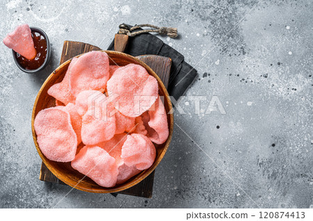Crunchy kerupuk prawn shrimp crackers, chips. Gray background. Top view. Copy space 120874413