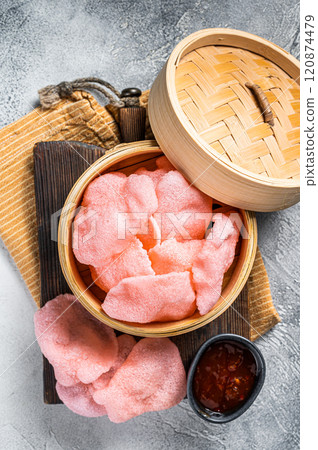 Indonesian prawn shrimp crackers or chips with sauce. White background. Top view Indonesian prawn shrimp crackers or chips with sauce. White background. Top view 120874479