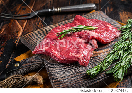 Raw alternative skirt beef steak on butcher board. Wooden background. Top view 120874482