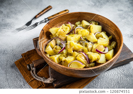 Bowl of warm potato salad with bacon, German Kartoffelsalat. White background. Top view Bowl of warm potato salad with bacon, German Kartoffelsalat. White background. Top view 120874551