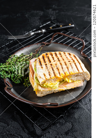 Club sandwich panini with Prosciutto ham. Black background. top view 120874621