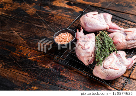 Farm eco friendly raw quails on kitchen table. Wooden background. Top view. Copy space 120874625