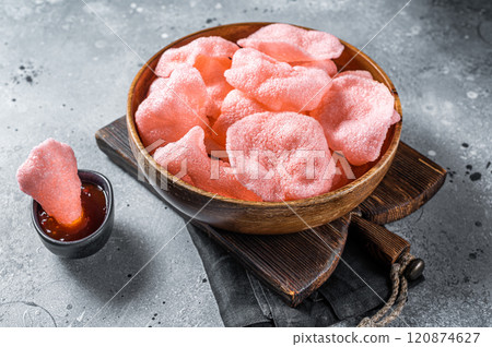 Crunchy kerupuk prawn shrimp crackers, chips. Gray background. Top view 120874627