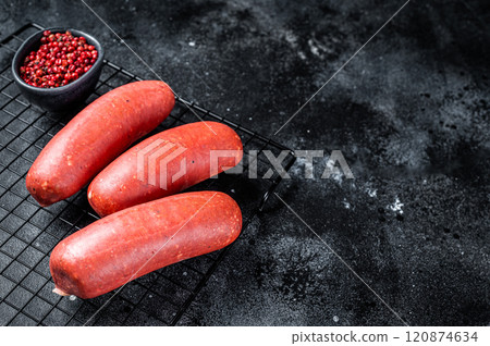 Turkish Sucuk beef meat sausage. Black background. Top view. Copy space Turkish Sucuk beef meat sausage. Black background. Top view. Copy space 120874634