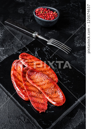 Fried on grill Sucuk beef meat sausage. Black background. Top view 120874637