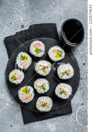 Korean style sushi Kimbap or gimbap made from steamed white rice. Gray background. Top view 120874643