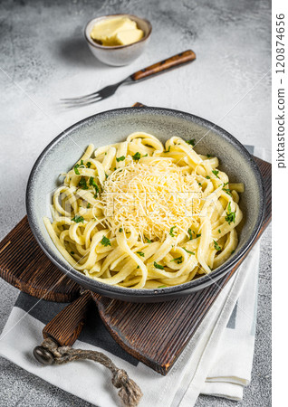 Spaetzle German egg noodles with cheese served with parsley. White background. Top view Spaetzle German egg noodles with cheese served with parsley. White background. Top view 120874656