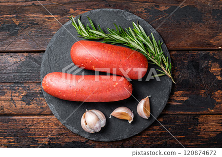 Turkish halal Sucuk meat sausage. Wooden background. Top view Turkish halal Sucuk meat sausage. Wooden background. Top view 120874672