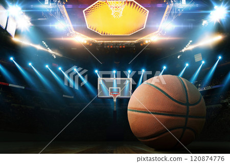 Basketball on the floor. Modern Basketball Arena with Rings with Spotlights, Creative Idea. Tournament and Win. Basketball game with full hall of fans on dark background. Basketball Championship. 120874776