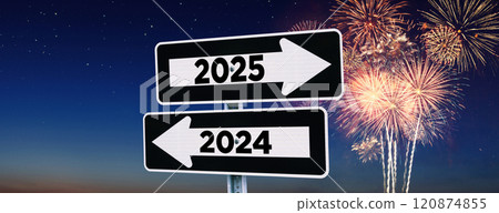 Road signs indicate the path to the new year 2025 and the old year 2024 at night sky with fireworks, creative idea. Choose a new road to 2025 year, concept. Change for the better. 120874855