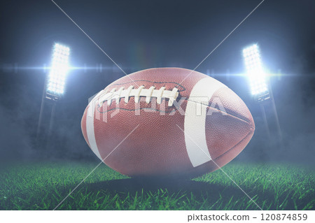 Soccer ball on the grass in a modern stadium with blue bright floodlights. American Soccer Cup, creative idea. Champions game at night. Winner. Horizontal sport theme poster, greeting cards, headers 120874859