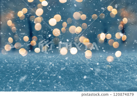 Amazing winter evening with snow and park with golden lights bokeh. New Year and Christmas, winter holiday background. magic winter weather Amazing winter evening with snow and park with golden lights bokeh. New Year and Christmas, winter holiday background. magic winter weather 120874879
