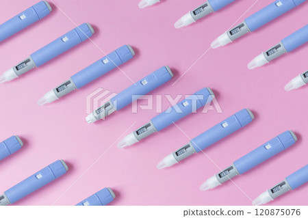 medical drug Ozempic injection lies on a pink background, top view. Medicine and weight loss, concept. injectors dosing pens for subcutaneous injection of antidiabetic medication or anti-obesity 120875076