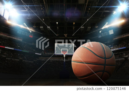 Basketball ball on the floor in a basketball arena with hoop and floodlights, concept. Basketball championship, creative idea. Winning. Sport card basketball tournament Basketball ball on the floor in a basketball arena with hoop and floodlights, concept. Basketball championship, creative idea. Winning. Sport card basketball tournament 120875146