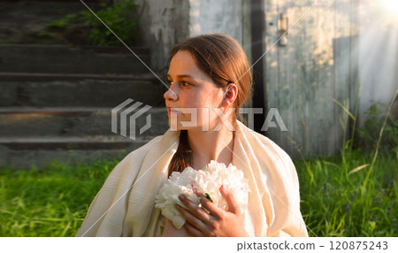 Young girl with white flowers 120875243