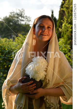 Young girl with white flowers 120875245