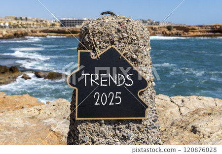 Planning trends 2025 new year symbol. Concept words Trends 2025 on beautiful yellow chalk blackboard. Beautiful stone beach blue sky sea background. Business trends 2025 new year concept. Copy space. 120876028
