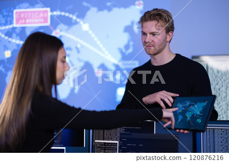 Cyber security teamwork in a Cyber Security Operations Center SOC to protect systems and technologies Cyber security teamwork in a Cyber Security Operations Center SOC to protect systems and technologies 120876216