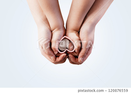 Financial literacy training from childhood concept. Mom with a child holds hands hearts with Polish zloty coins. Financial savings and successful investments. 120876559