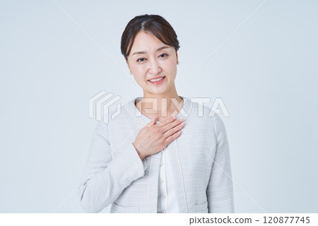 Business woman putting hand on chest 120877745