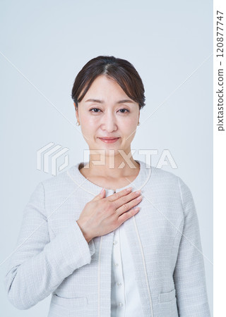 Business woman putting hand on chest Business woman putting hand on chest 120877747