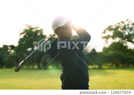 Man is playing golf in morning. Man is playing golf in morning. 120877834