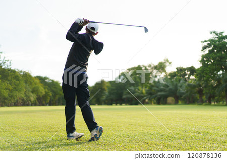 Man is playing golf in morning. 120878136