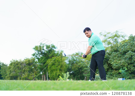 Man is playing golf in morning. Man is playing golf in morning. 120878138