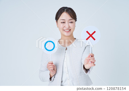 Businesswoman holding a plate with a circle and a cross 120878154
