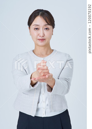 Business woman nodding with both hands 120878192