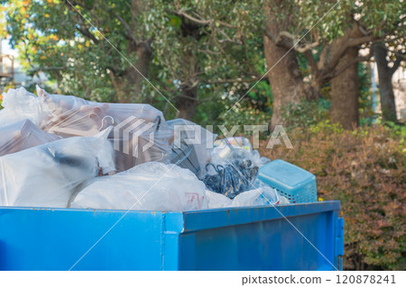 Industrial waste containers installed at a commercial facility 120878241