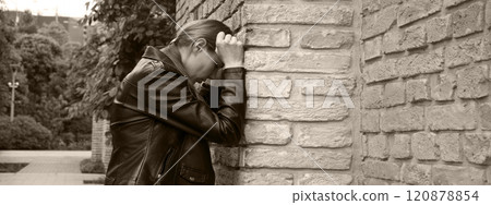 Sad woman at the wall Sad woman at the wall 120878854