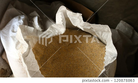 open canvas bag with small fraction bird feed, combined loose feed for farm poultry in a large light bag open canvas bag with small fraction bird feed, combined loose feed for farm poultry in a large light bag 120878863