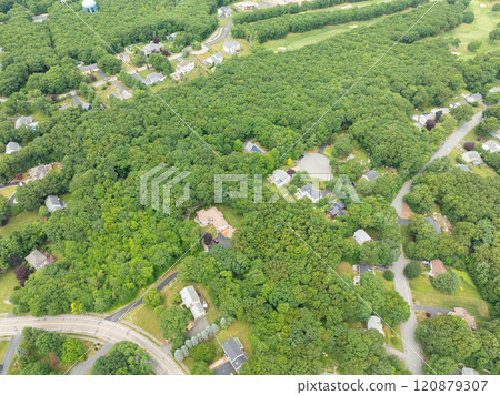 Aerial view of Suburban neighborhood Norfolk County, Massachusetts with green forest, with big villa 120879307