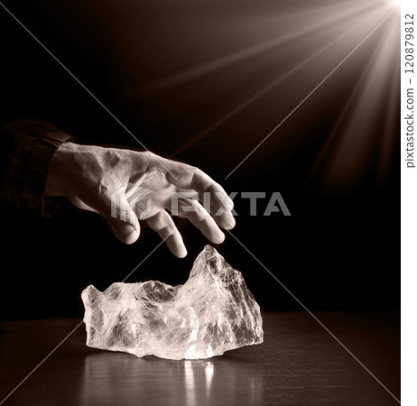 The hand reaches out to steal the precious stone 120879812