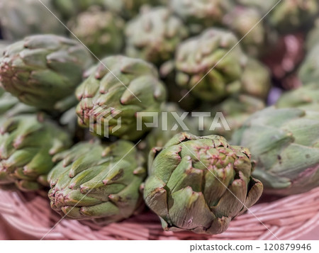 Fresh Green Artichokes in a Rustic Basket Fresh Green Artichokes in a Rustic Basket 120879946