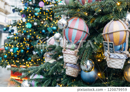 New Year's colorful trees in front of the Central Department Store in Moscow on Kuznetsky Most New Year's colorful trees in front of the Central Department Store in Moscow on Kuznetsky Most 120879959