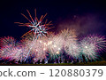 Fireworks rising in the night sky 120880379