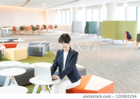 Woman in a suit working in the office Woman in a suit working in the office 120883294