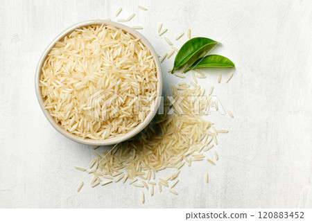 bowl of raw rice 120883452